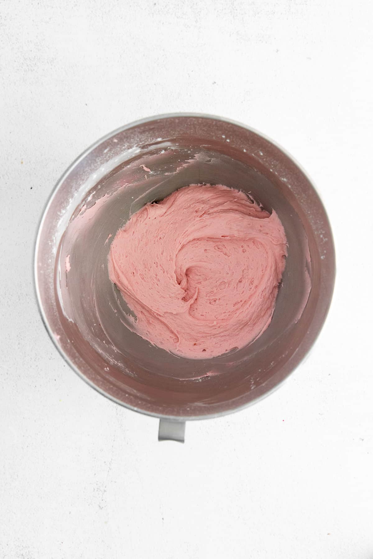 buttercream frosting in a metal bowl.