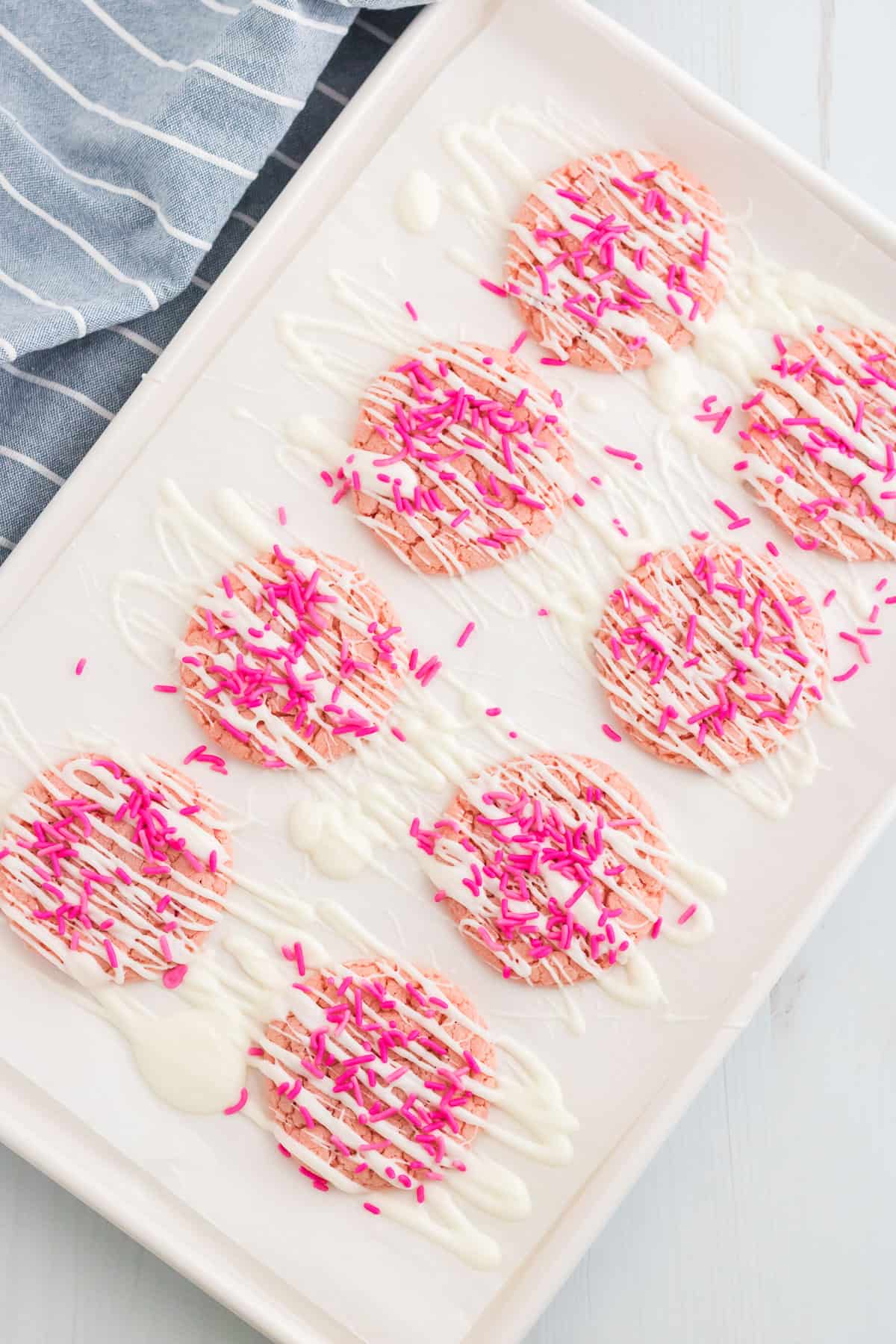strawberry cake mix cookies on a sheet pan.
