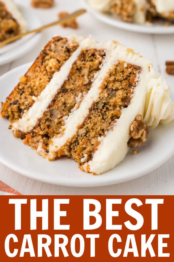 a slice of carrot cake on a white plate.