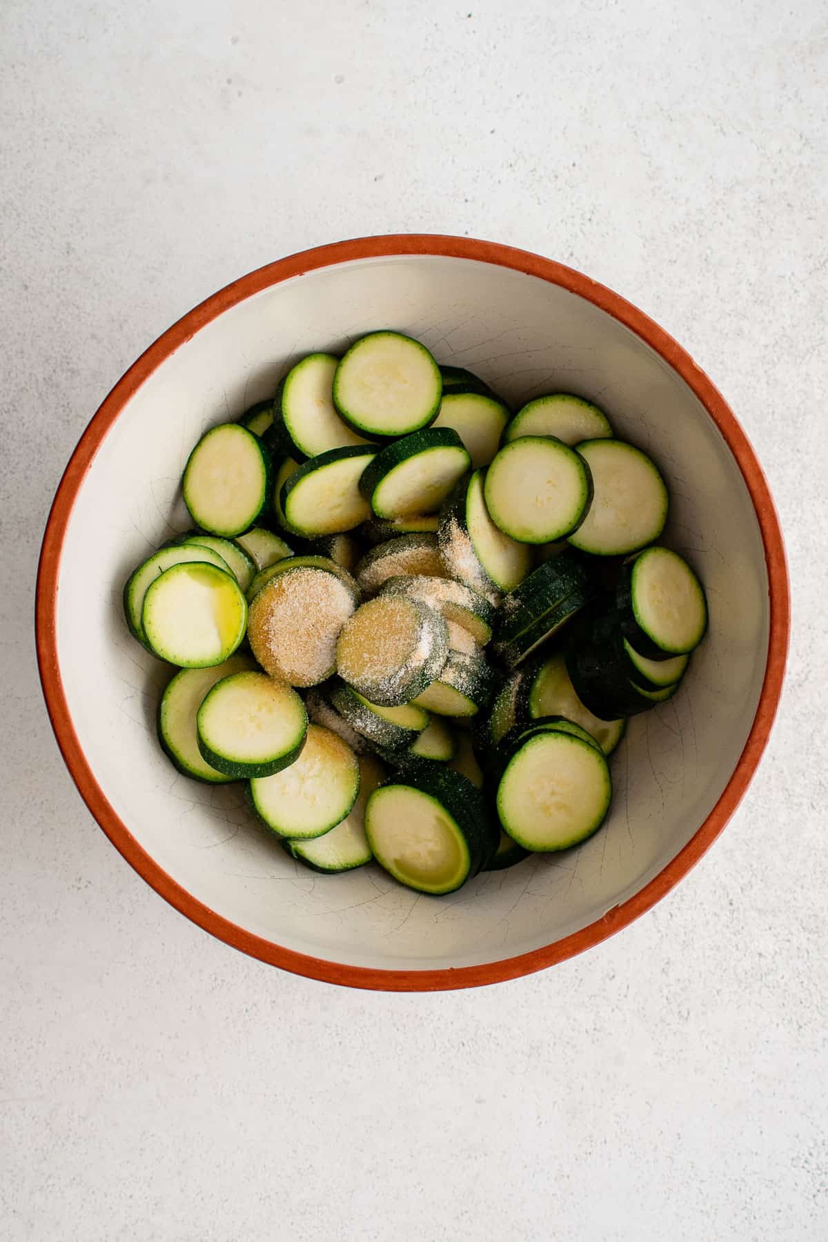 a bowl of zucchini with spices.