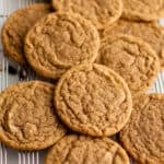 a pile of cookies on a wire rack.
