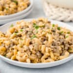 a white plate of cheeseburger macaroni pasta.