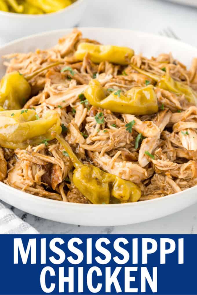 shredded chicken and peperoncini peppers in a bowl.