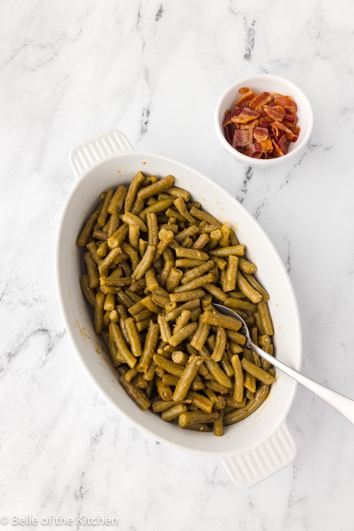 green beans in a white baking dish.