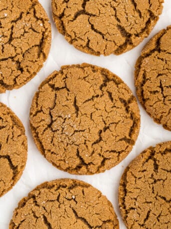 molasses cookies on a white counter top.