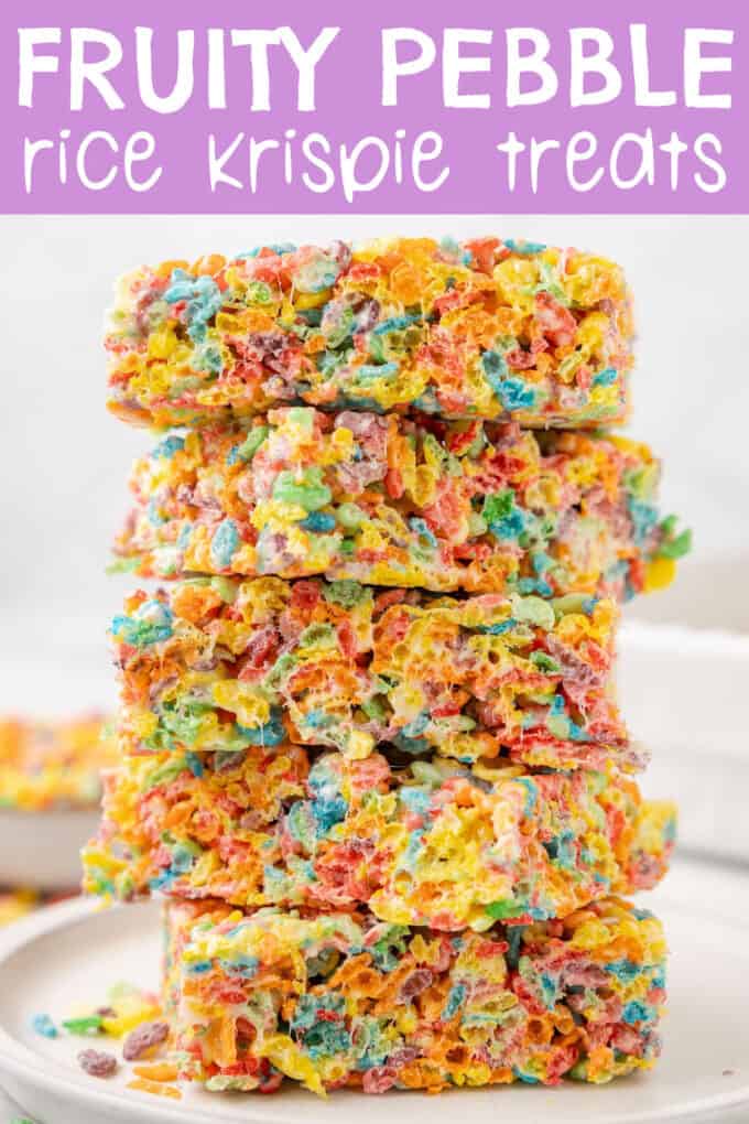 a stack of fruity pebble rice crispy treats on a white plate.