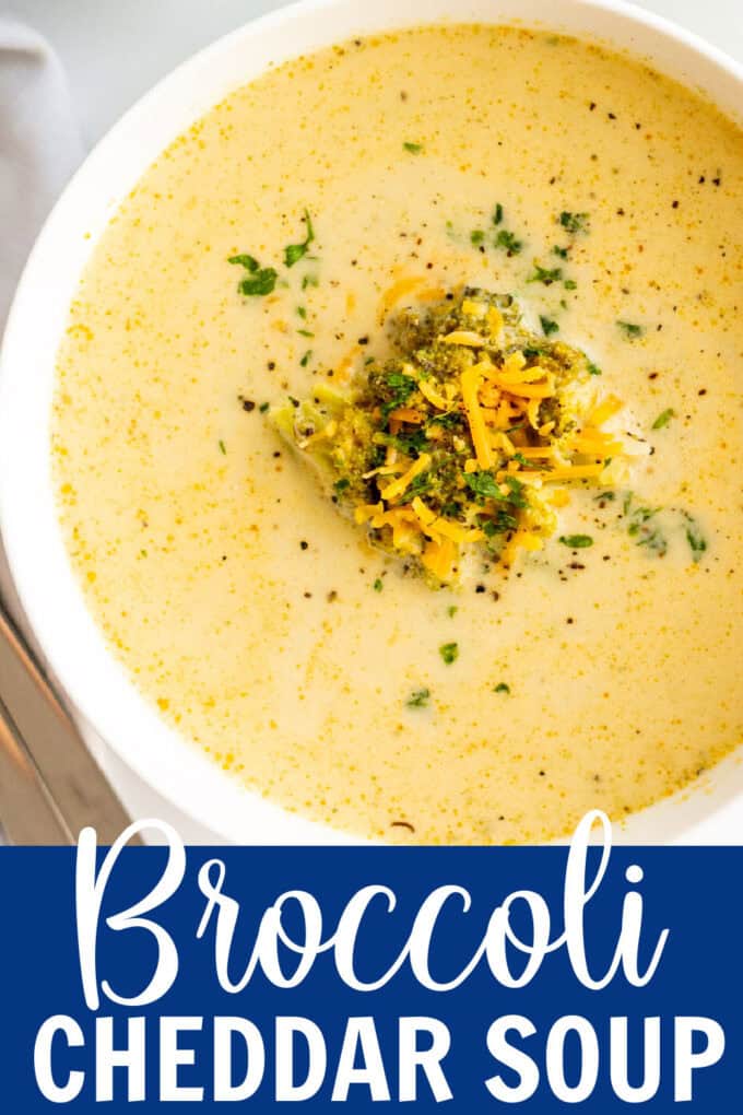 A white bowl of broccoli cheddar soup.