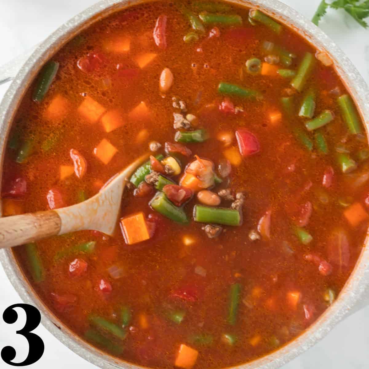 a dutch oven full of soup.