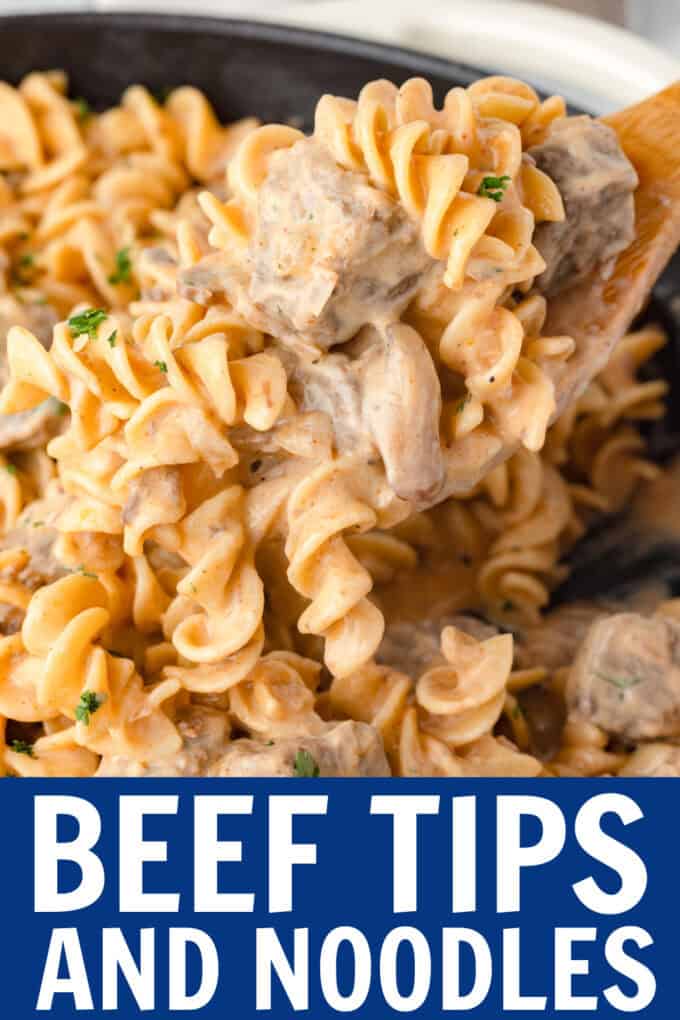 A wooden spoon scooping up beef and noodles.