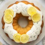 A lemon bundt cake on a white plate.