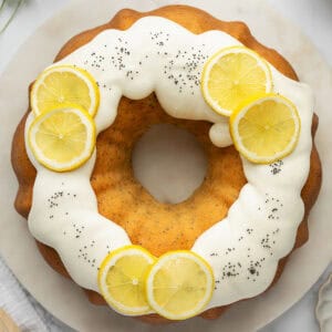 A lemon bundt cake on a white plate.