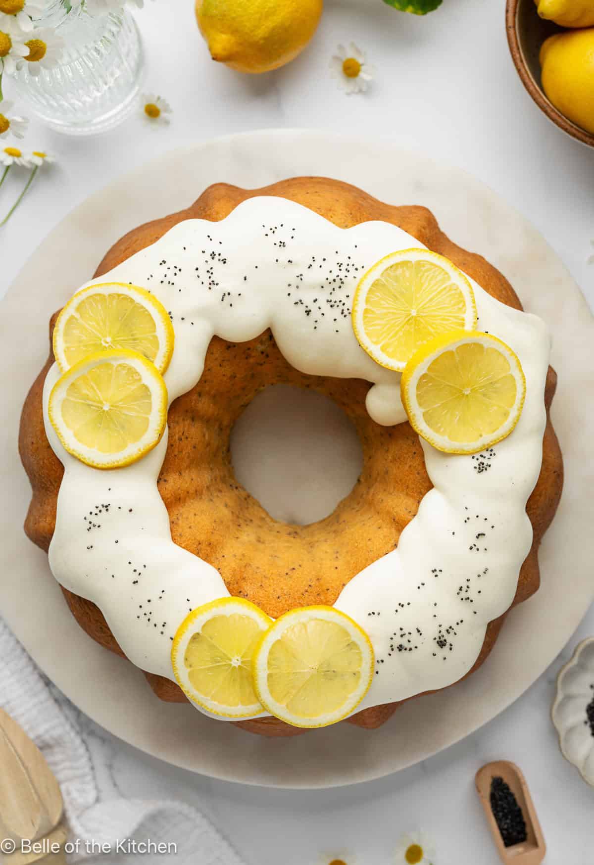 A lemon bundt cake on a white plate.