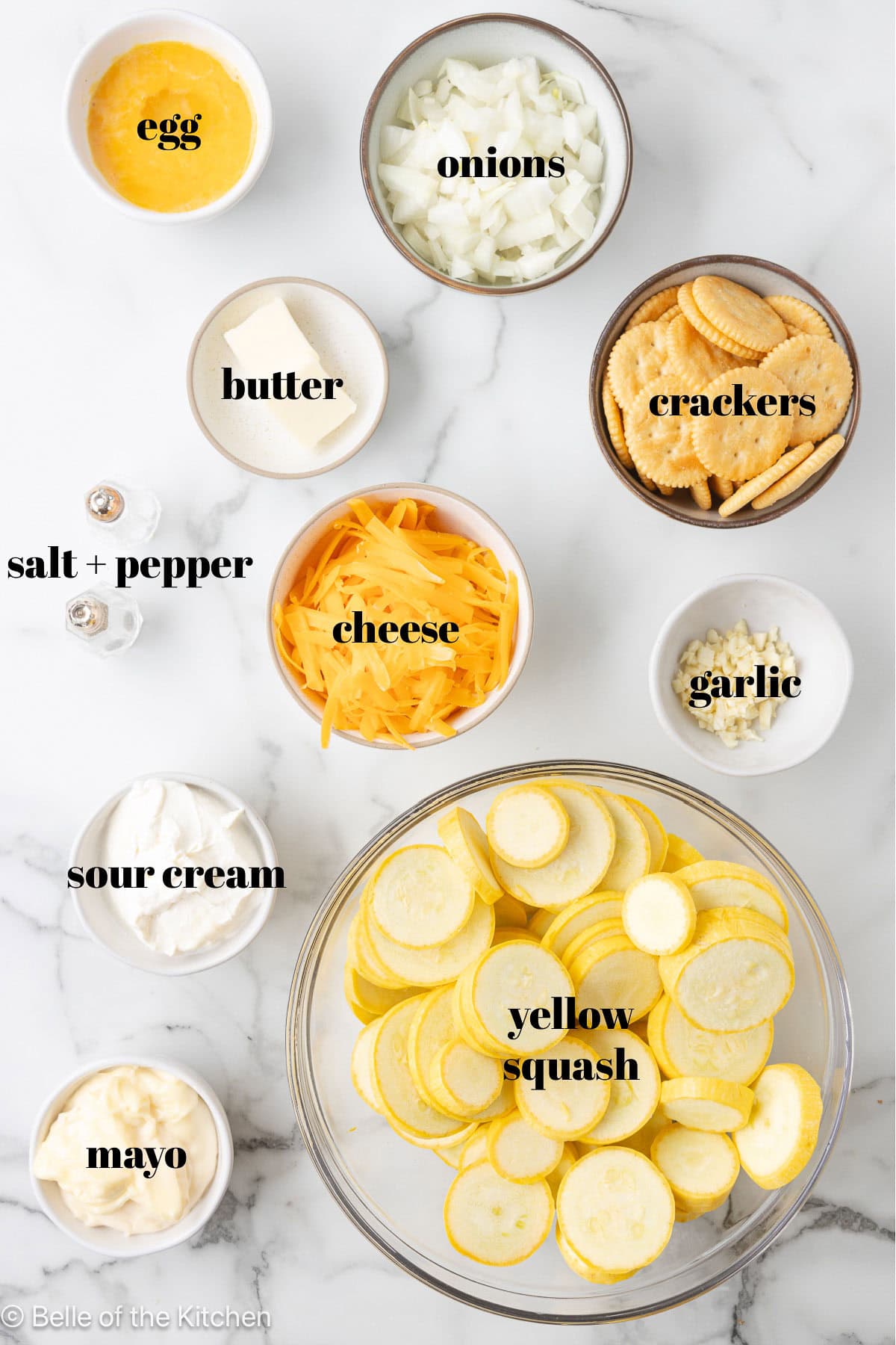 Ingredients in bowls on a marble counter top.