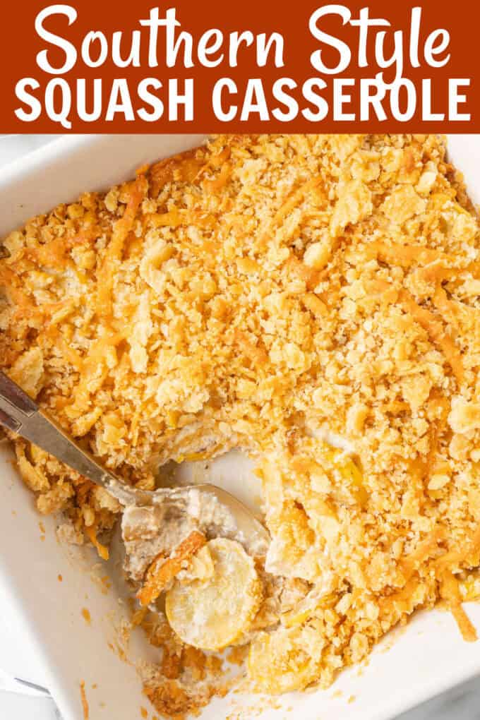A spoon scooping up squash casserole from a baking dish.