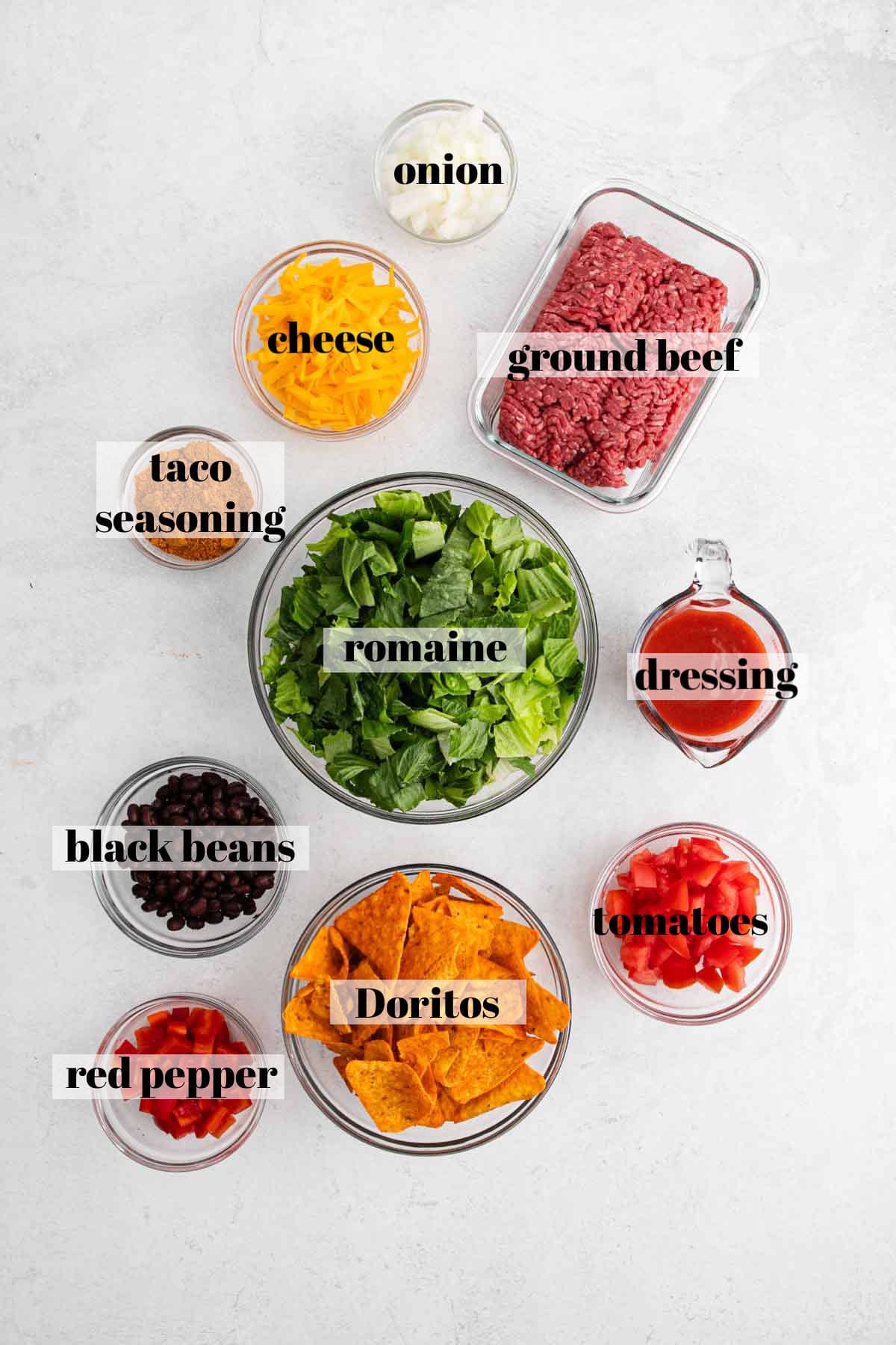 Ingredients in bowls on a white counter top.