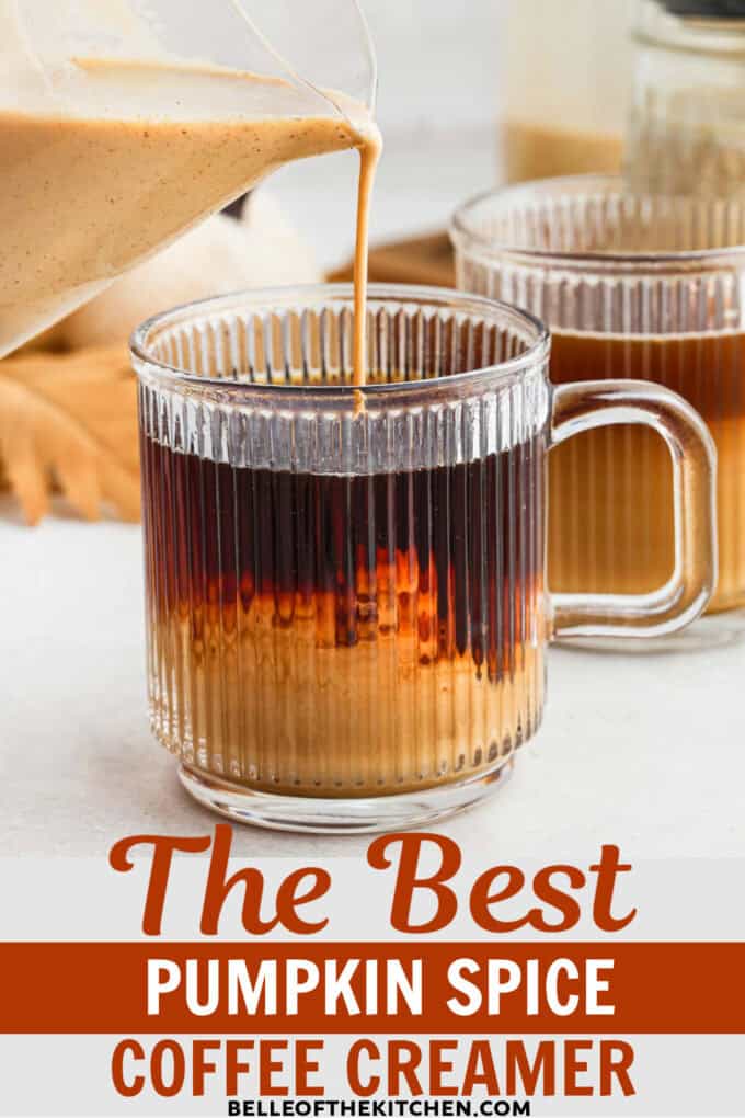 Pumpkin spice coffee creamer being poured into a mug of coffee.