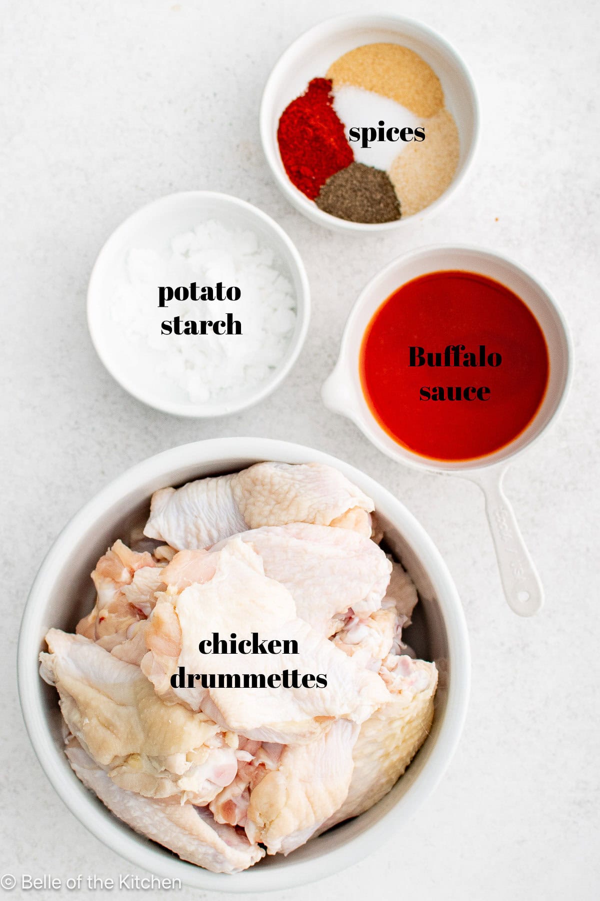 Ingredients in bowls on a white counter top.