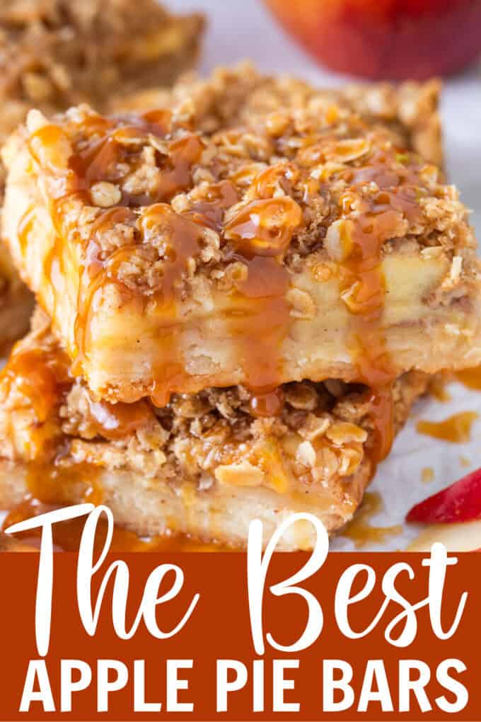 Two slices of apple pie bars stacked with caramel drizzle on top.