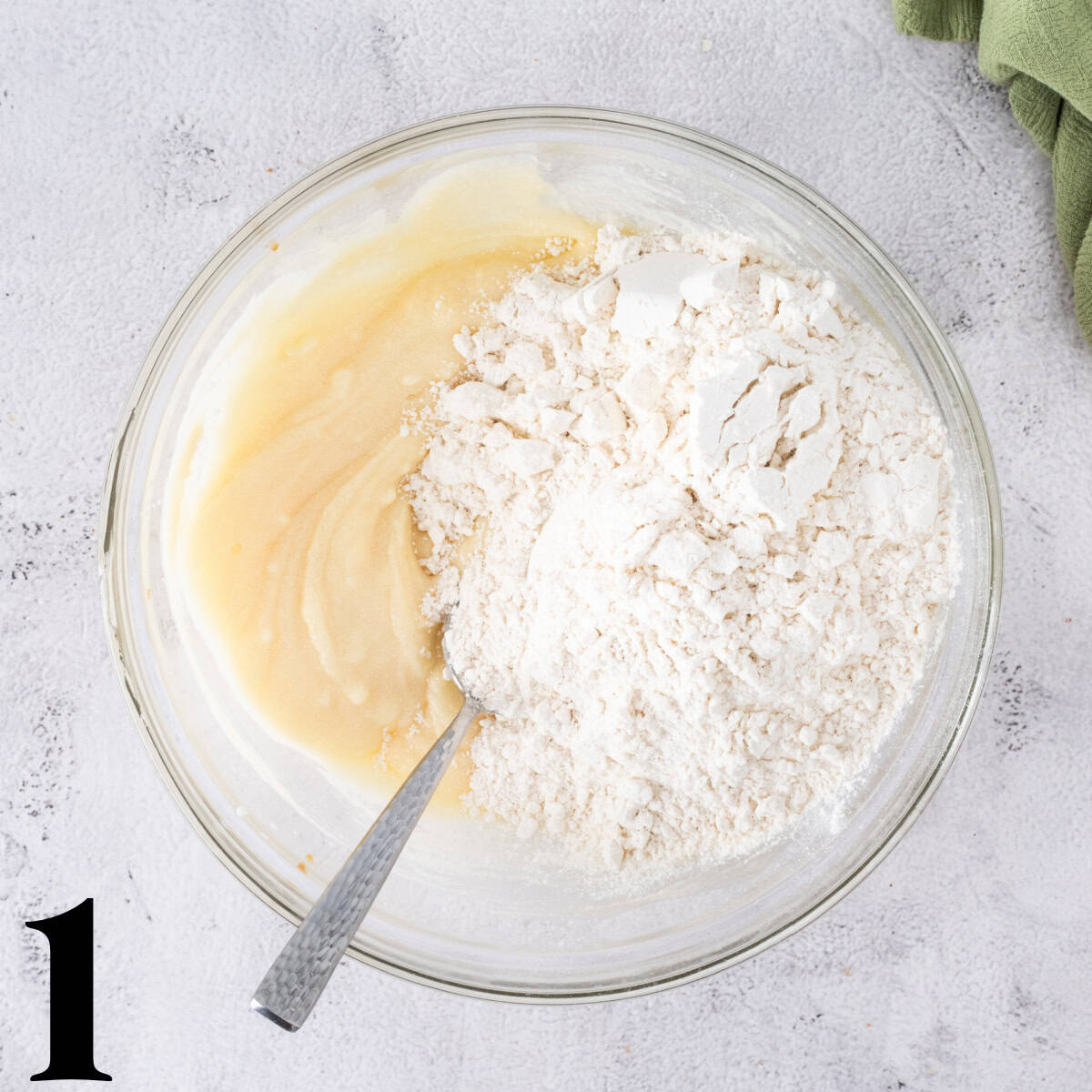 A glass bowl of dough.