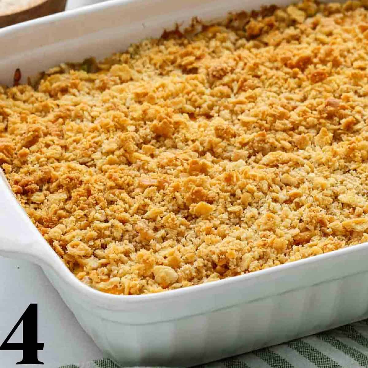 A white baking dish of chicken broccoli rice casserole.