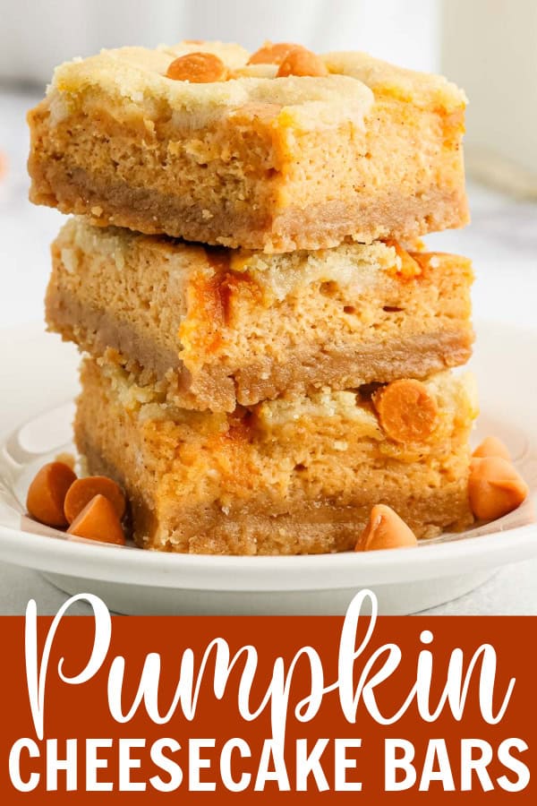 Three pumpkin cheesecake bars stacked on a plate.