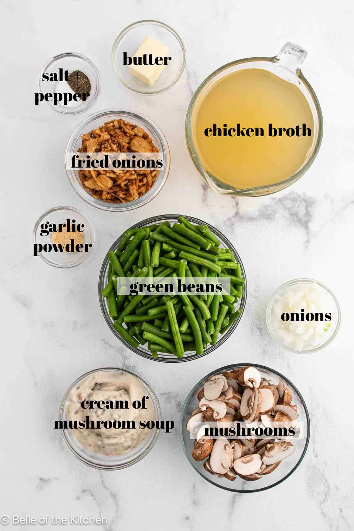 Ingredients in bowls on a white counter top.