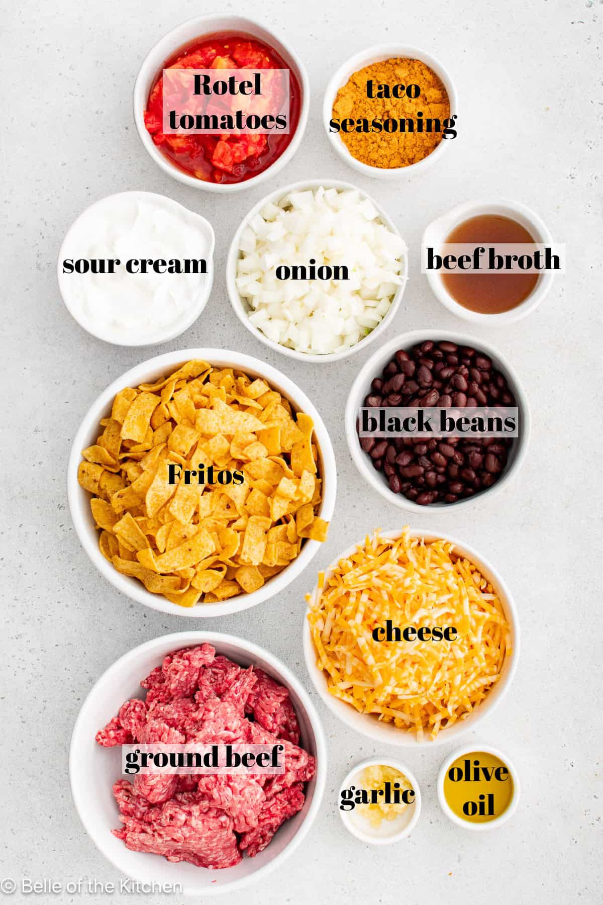 Ingredients in bowls on a white counter top.