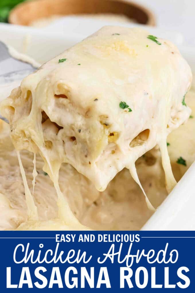 A spatula lifting a lasagna roll from a baking dish.