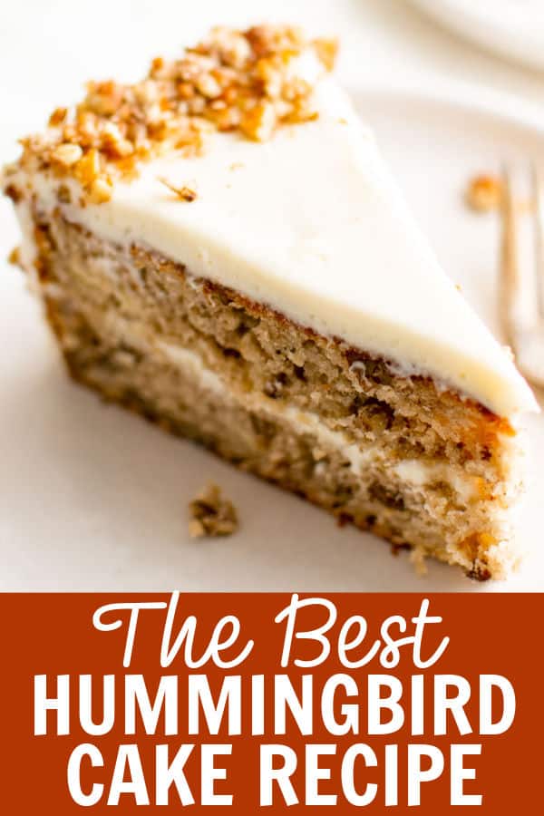 A slice of hummingbird cake on a white plate.