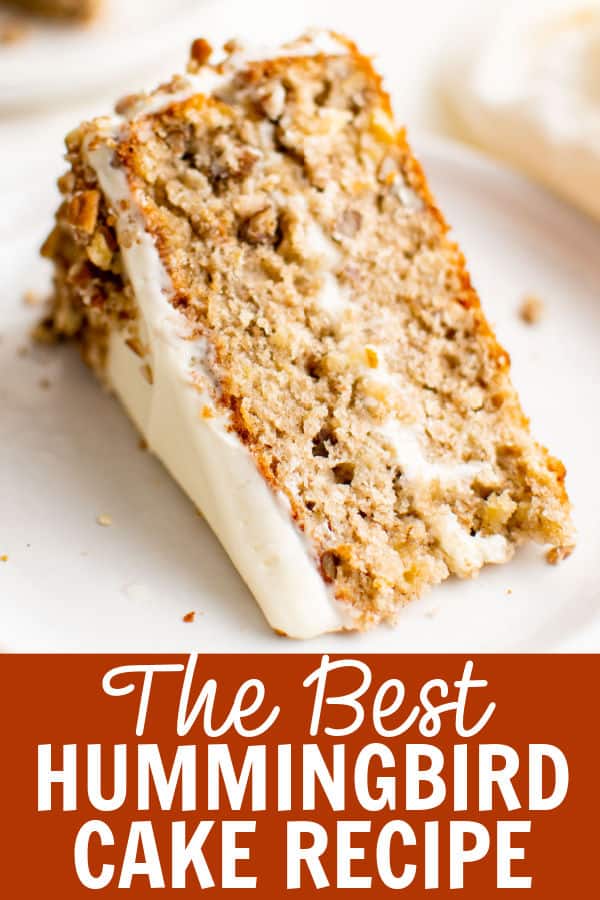 A slice of hummingbird cake on a white plate.