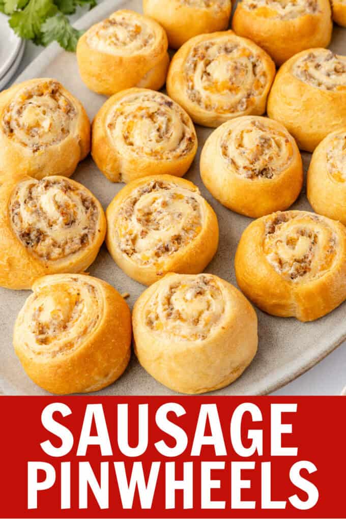Sausage pinwheels on a white plate.