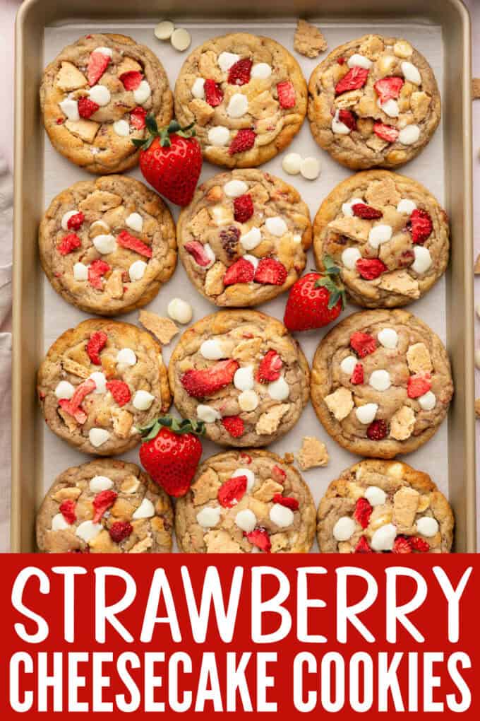 A cookie sheet full of strawberry cheesecake cookies.