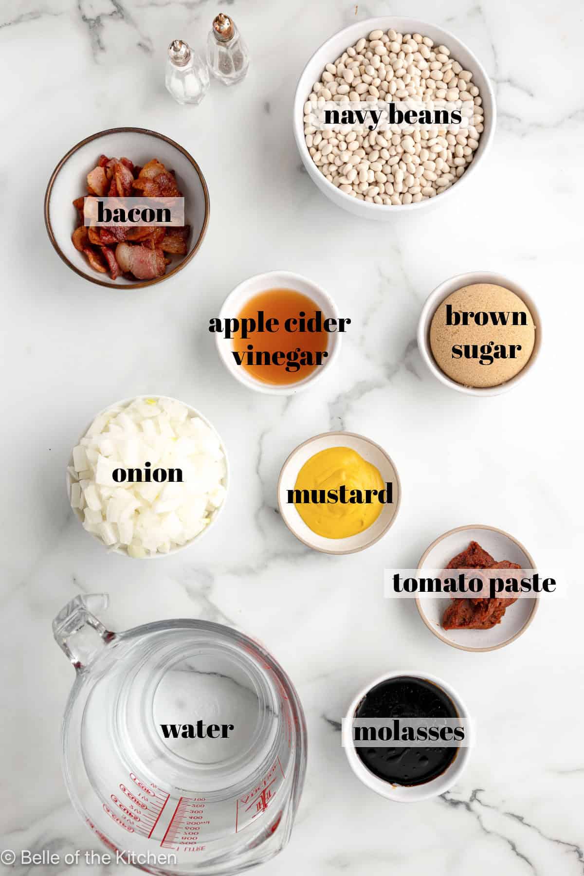 Ingredients in bowls on a marble counter top.