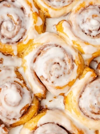 Cinnamon rolls in a baking dish.