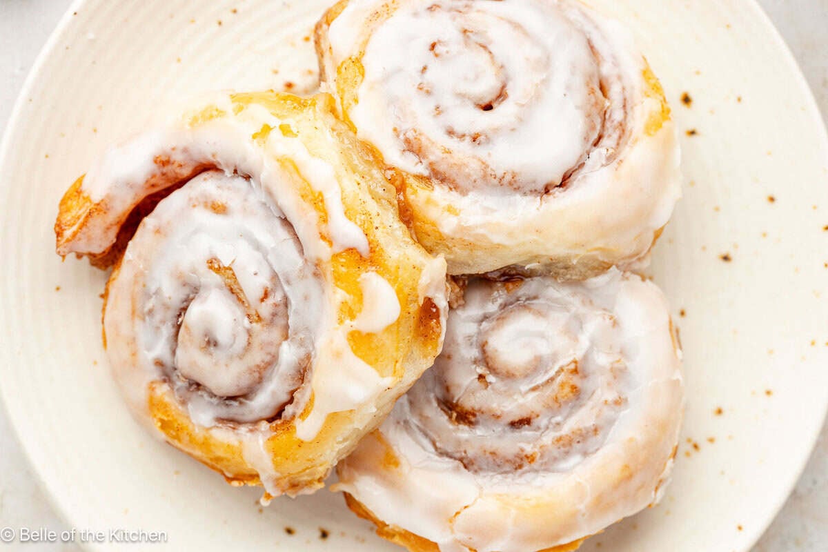 Cinnamon rolls on a white plate.