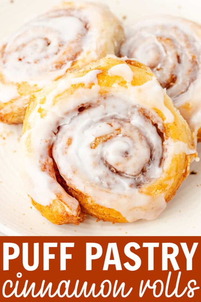 A cinnamon roll on a white plate.