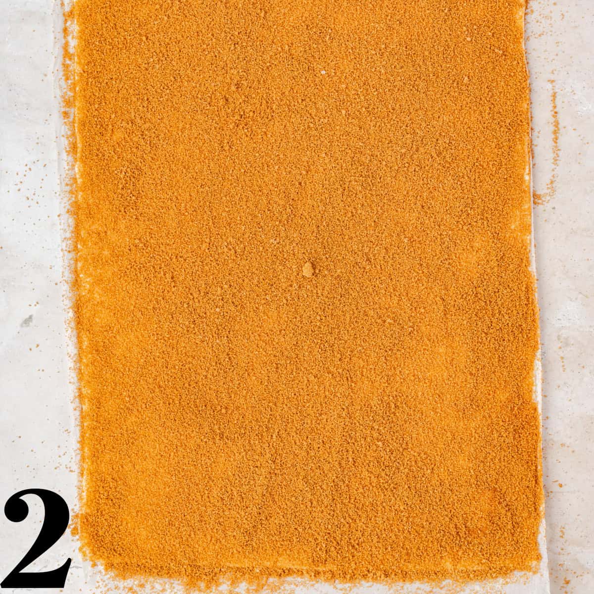Puff pastry topped with cinnamon and brown sugar.