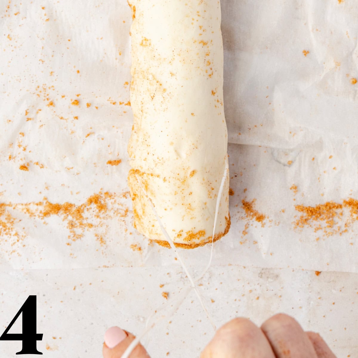 Puff pastry being cut with floss.