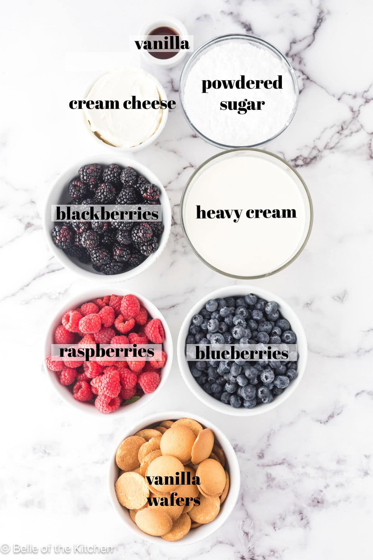 Bowls of ingredients on a marble counter top.