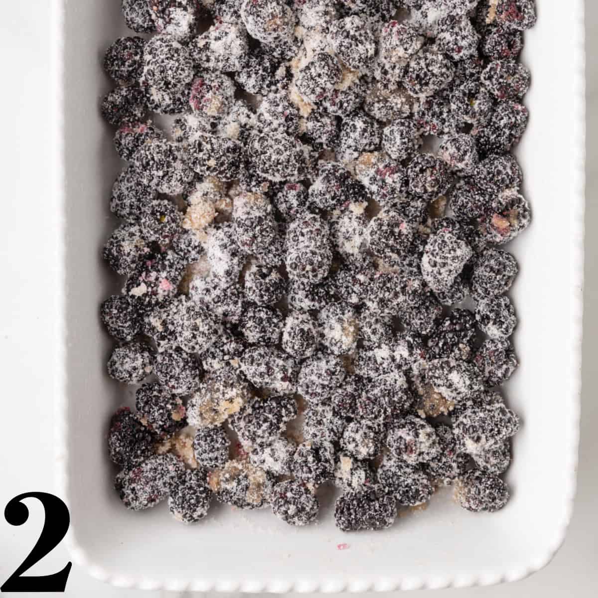 A baking dish full of sugar coated blackberries.