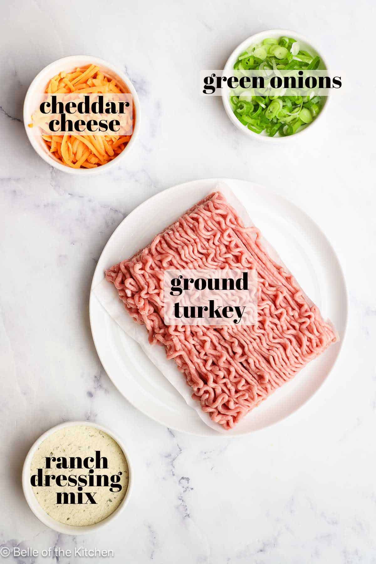 Ingredients in bowls on a marble counter top.