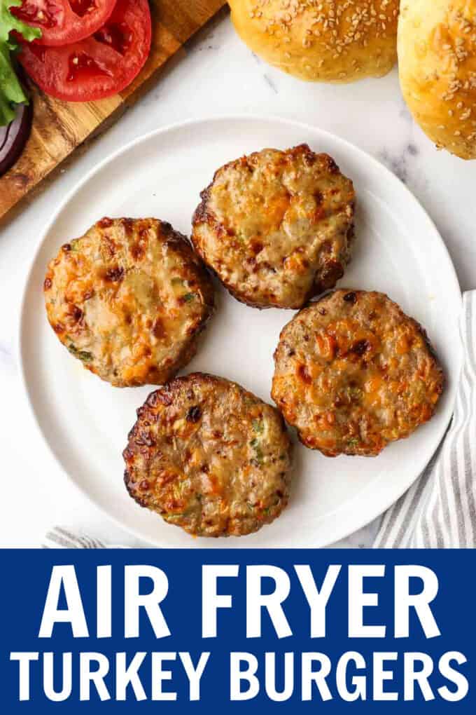 Turkey burger patties on a white plate.