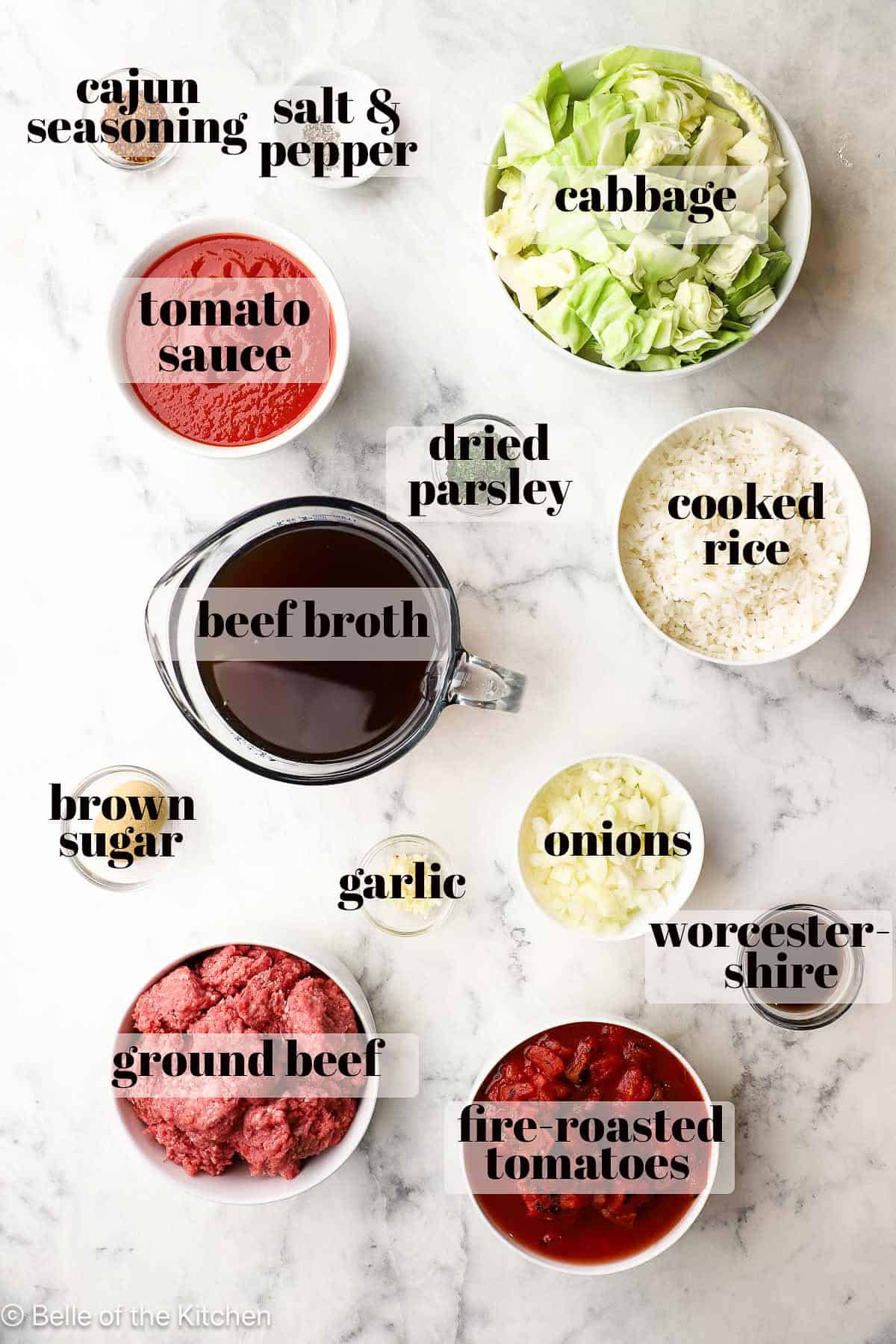 Bowls with ingredients on a marble counter top.