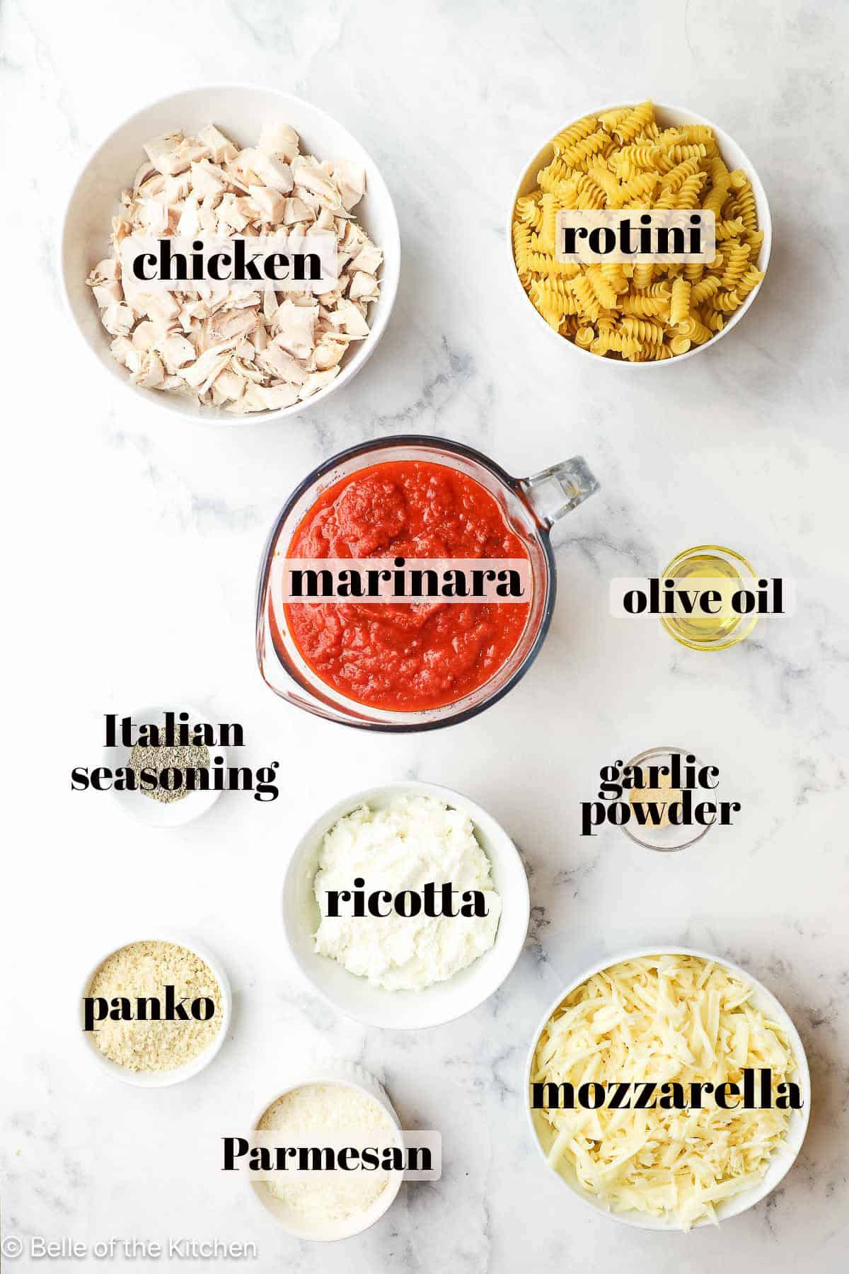 Ingredients in bowls on a marble counter top.